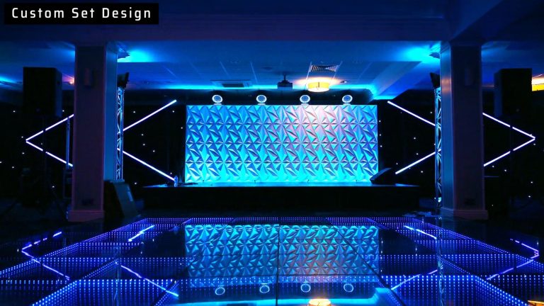 Futuristic-themed corporate event at the 1883 Suite in Stockport County Football Club with modern stage and lighting design